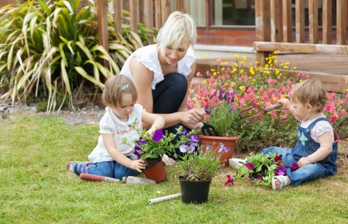 Close-up of a gardener planting native shrubs in a Richmond residential garden