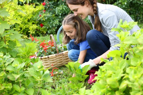 Team of insured gardeners preparing equipment